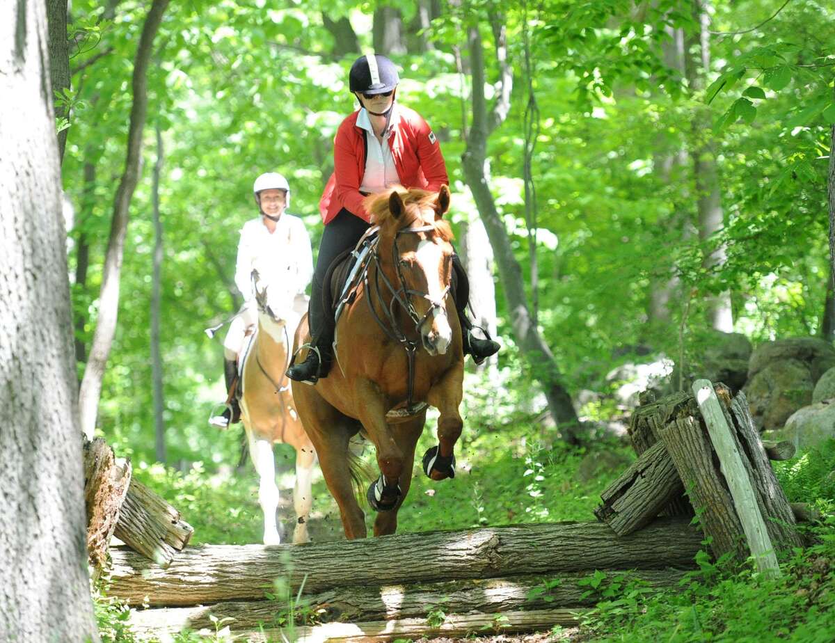 Members of the Greenwich Riding and Trails Association celebrating 100 years of the horse trail riding system in Greenwich. A similar ride will take place this Mother’s Day at the Sabine Farm Field.