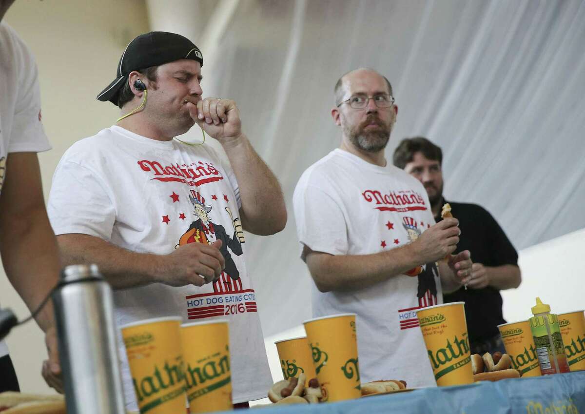 Some contestants found the contest to be more than they could chew. Photos of Nathan’s Famous Hotdog Eating Contest at in Houston in 2016.