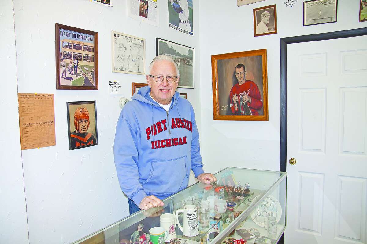   Dennis Hafeli, of Port Austin, stands behind the counter of his store, Line Drive Sports and Other Memorabilia, which contains a wide variety of collectibles.