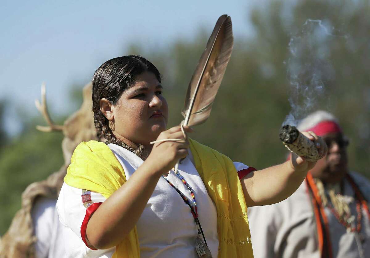 Alexis Reyes joins in performing ceremony with the indigenous group, Tap Pilam Coahuiltecan Nation, during the World Heritage Inscription Ceremony at Mission San Jose on Oct. 17, 2015. A bill that would recognize Tap Pilam Coahuiltecan Nation as a Native American Indian tribe passed unanimously in the Texas House last month.