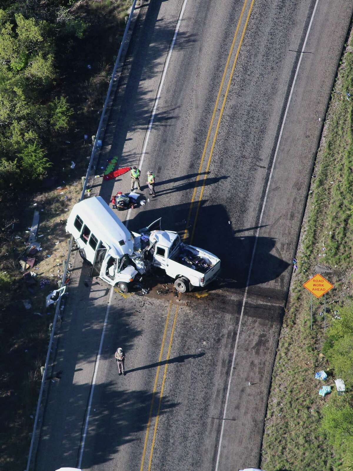 Investigators comb over the scene of an accident where 13 individuals were killed after a bus collided with a pickup truck head-on south of Garner State Park on Highway 83. The bus was carrying a group from the New Braunfels First Baptist Church who had been camping at the park. The driver of the truck, 20-year-old Jack Dillon Young, was air-lifted to a San Antonio hospital in stable condition. The NTSB is investigating the accident.