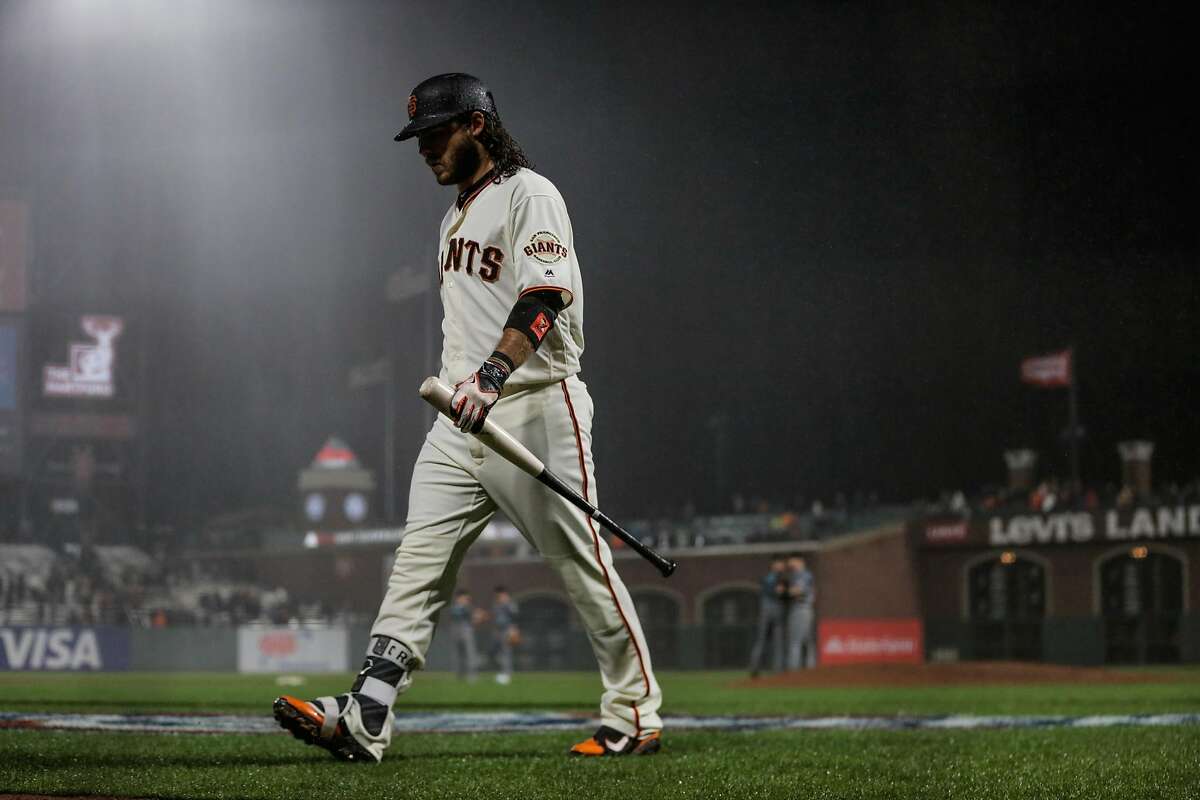 Brandon Crawford walks back to the dugout after striking out during the bottom of the 9th inning of a game between the San Francisco Giants and the Arizona Diamondbacks at AT&T Park on April 11, 2017.