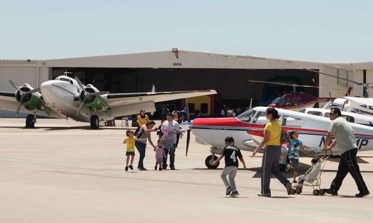 Families walk the tarmac during HobbyFest at Hobby Airport