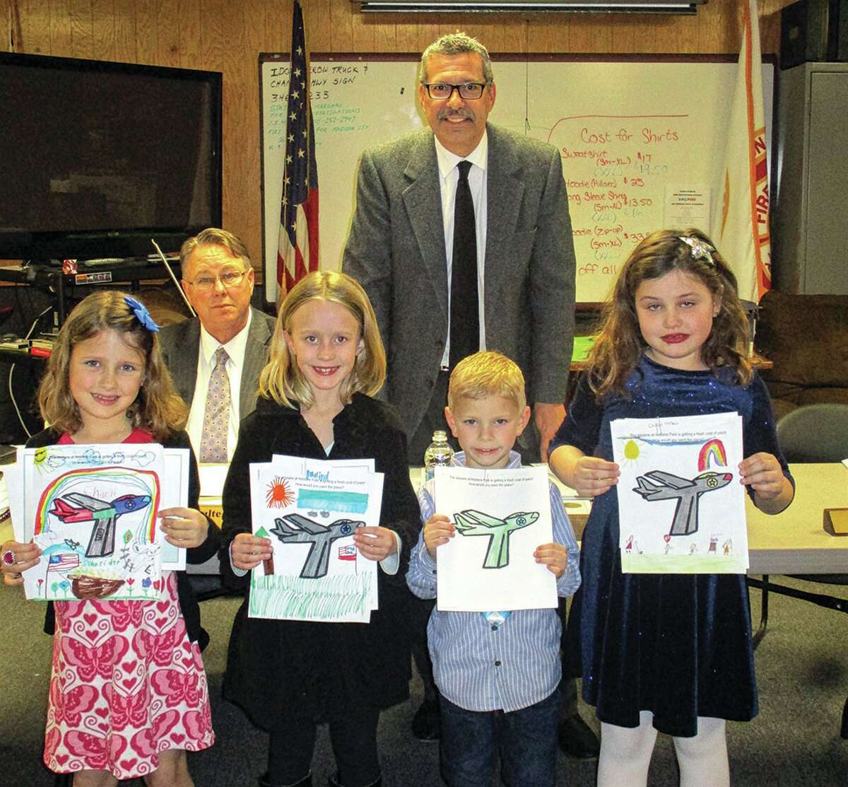 Supervisor Frank Miles presents certificates and prizes to winners of the Township in Action coloring contest: Charli Schneider, Rosalind Hovan, Michael Schumer, and Cecilia Verbais. Not pictured – Ben Keith.