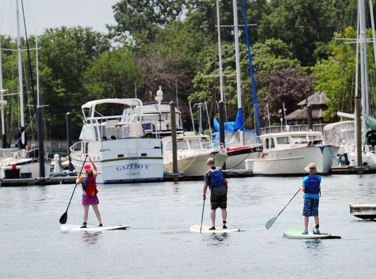 Paddle boarders in Stamford Harbor. Accidents involving kayaks, paddleboards and canoes are on the rise, while those involving boats have declined along with registrations over the past decade.