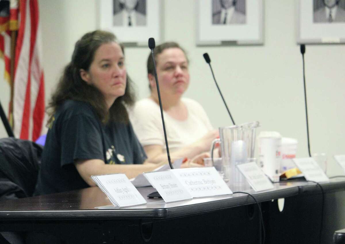 Board of Education members Jennifer Maxon-Kennelly, left, and Trish Pytko at an April 6, 2017 board meeting in Fairfield, Conn. Maxon-Kennelly and Pytko were among five remaining members present after three walked out early in the night.
