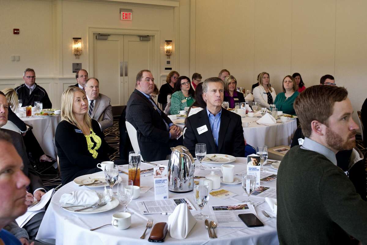 Attendees listen as Saginaw Valley State University Associate Provost Dr. David M. Callejo Perez speaks during the United Way's ALICE report (Assisted Limited, Income Constrained and Employed) on Wednesday at the Midland Country Club. Perez helped create the report.