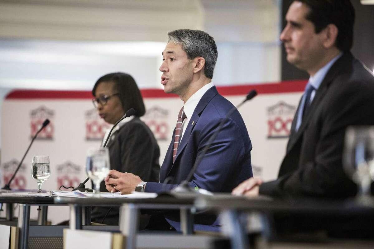District 8 City Councilman Ron Nirenberg (center) speaks onstage at a mayoral debate alongside San Antonio Mayor Ivy Taylor and Bexar County Democratic Chairman Manuel Medina. The candidates were hosted by the San Antonio Manufacturers Association, which asked about minimum wage requirements, regulations and other issues facing manufacturers.