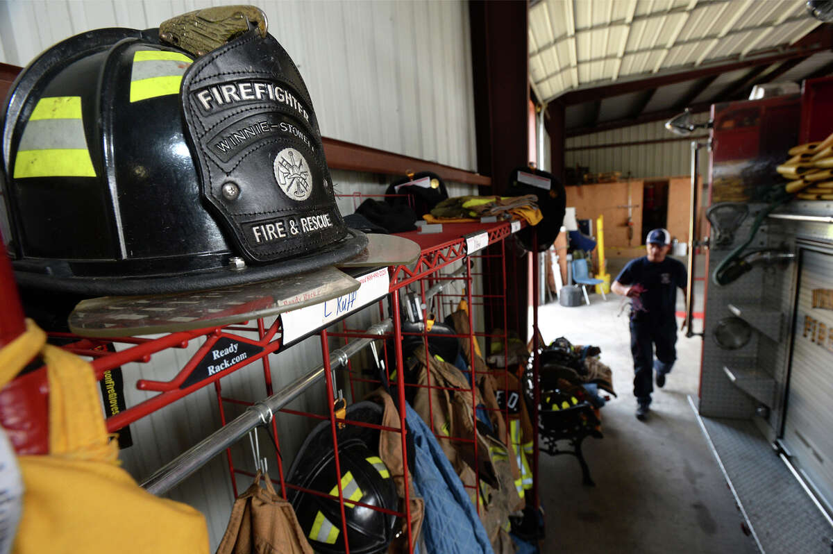 Volunteer Firefighter Clay Gamble works on the oxygen truck at the Winnie-Stowell fire station Wednesday. A Texas Senate bill entered the floor earlier that day that, if passed, would grant EMS and firefighters the right to carry firearms while responding to emergency calls. Photo taken Wednesday, April 12, 2017 Guiseppe Barranco/The Enterprise