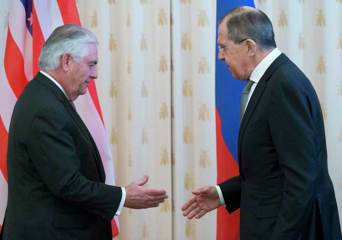 US Secretary of State Rex Tillerson, left, and Russian Foreign Minister Sergey Lavrov shake hands prior to their talks in Moscow, Russia, Wednesday, April 12, 2017. Tillerson's Moscow talks hinge on new US leverage over Syria. (AP Photo/Alexander Zemlianichenko)