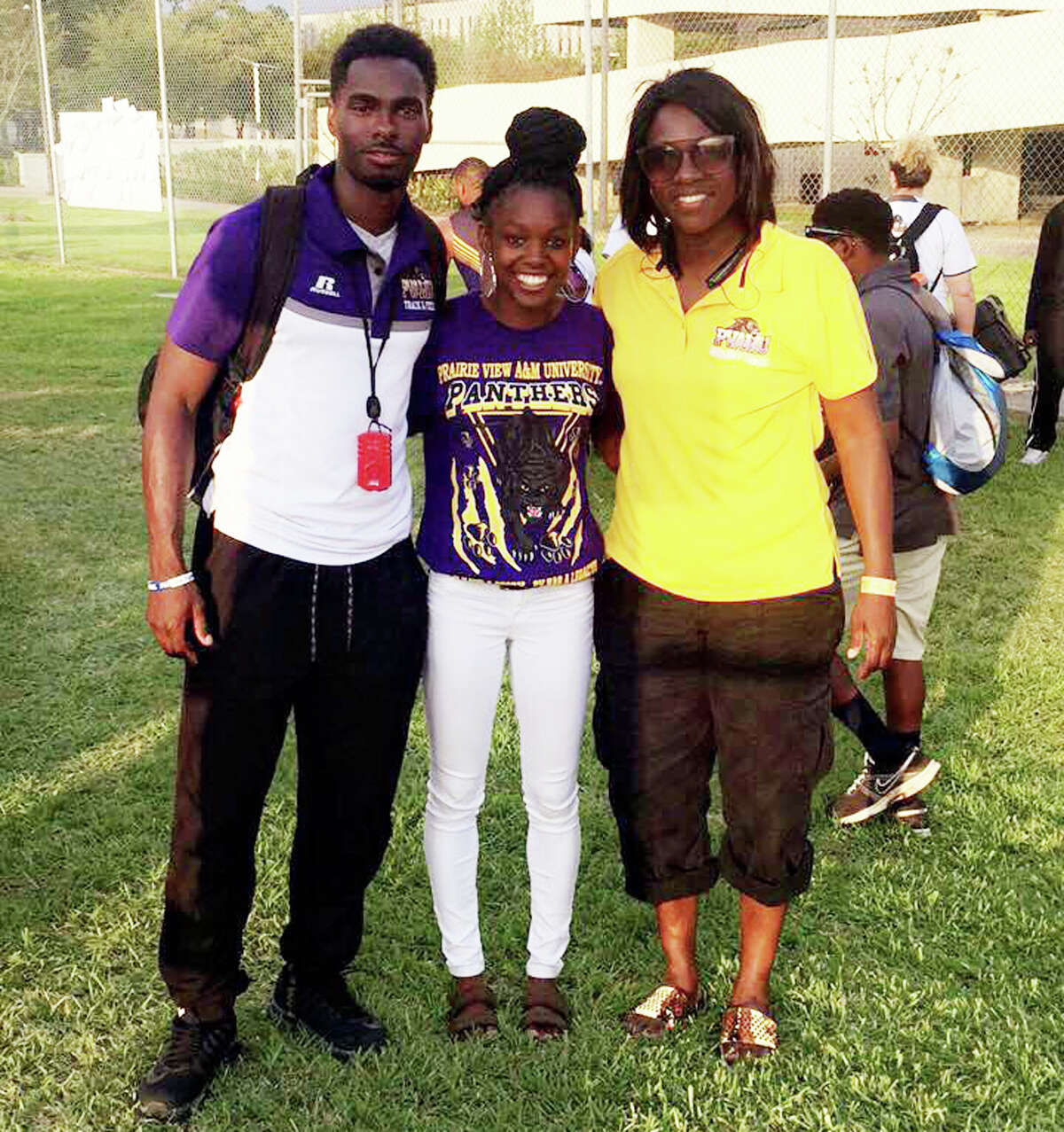 Kaizha Roberts, center, stands with Prairie View A&M assistant track coach and recruiting coordinator Phillip Butler, left, and Prairie View head track coach Angela Williams, right.