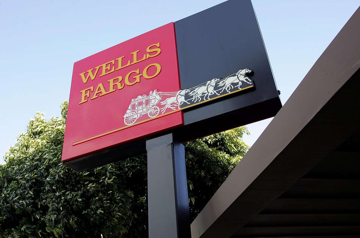 FILE - APRIL 13, 2017: Wells Fargo has reported flat first quarter earnings, reporting a profit of $5.46 billion, or $1 a share, compared to $5.46 billion or 99 cents a share in the same period of last year. SAN FRANCISCO - MARCH 20: The Wells Fargo logo is seen on a sign outside of a Wells Fargo Home Mortgage branch office March 20, 2007 in San Francisco, California. San Francisco based Wells Fargo & Co. announced today that it is cutting over 500 jobs in the home mortgage divisions in South Carolina, Arizona and California that cater to high-risk borrowers. (Photo by Justin Sullivan/Getty Images)