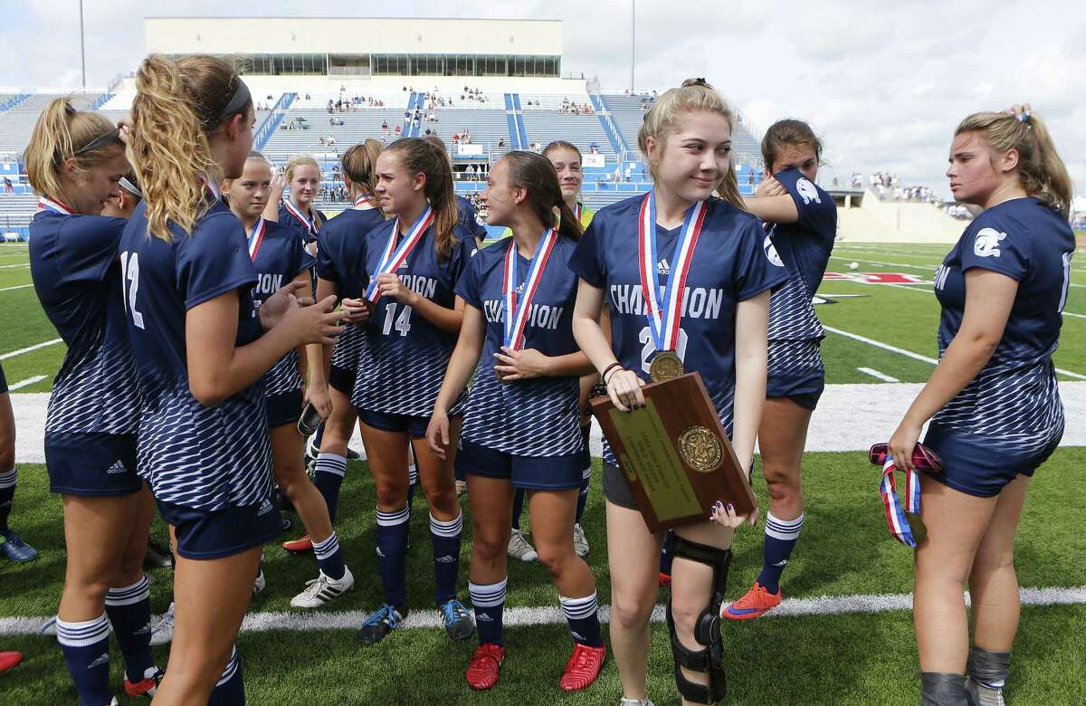 Boerne Champion girls soccer team stands with a third place trophy after falling to Dallas Highland Park 2-0 during the UIL soccer class 5A semifinals at Birkelbach Field, Georgetown, Thursday, April. 13, 2017.
