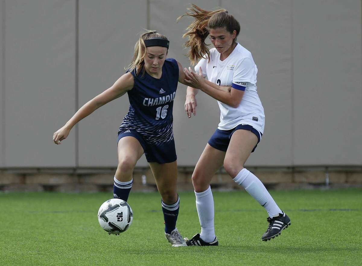 Boerne Champion's Kaitlin Moore (16) and Dallas Highland Park's Anna Robertson (13) battle for the ball during the UIL soccer class 5A semifinals at Birkelbach Field, Georgetown, Thursday, April. 13, 2017. (Stephen Spillman)