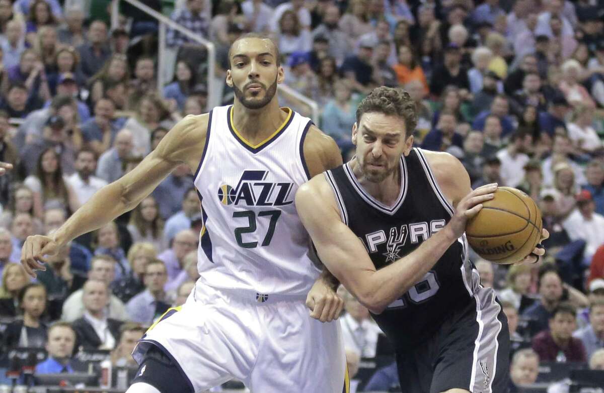 Spurs center Pau Gasol (right) drives around Utah Jazz center Rudy Gobert (27) during the first half on April 12, 2017, in Salt Lake City.