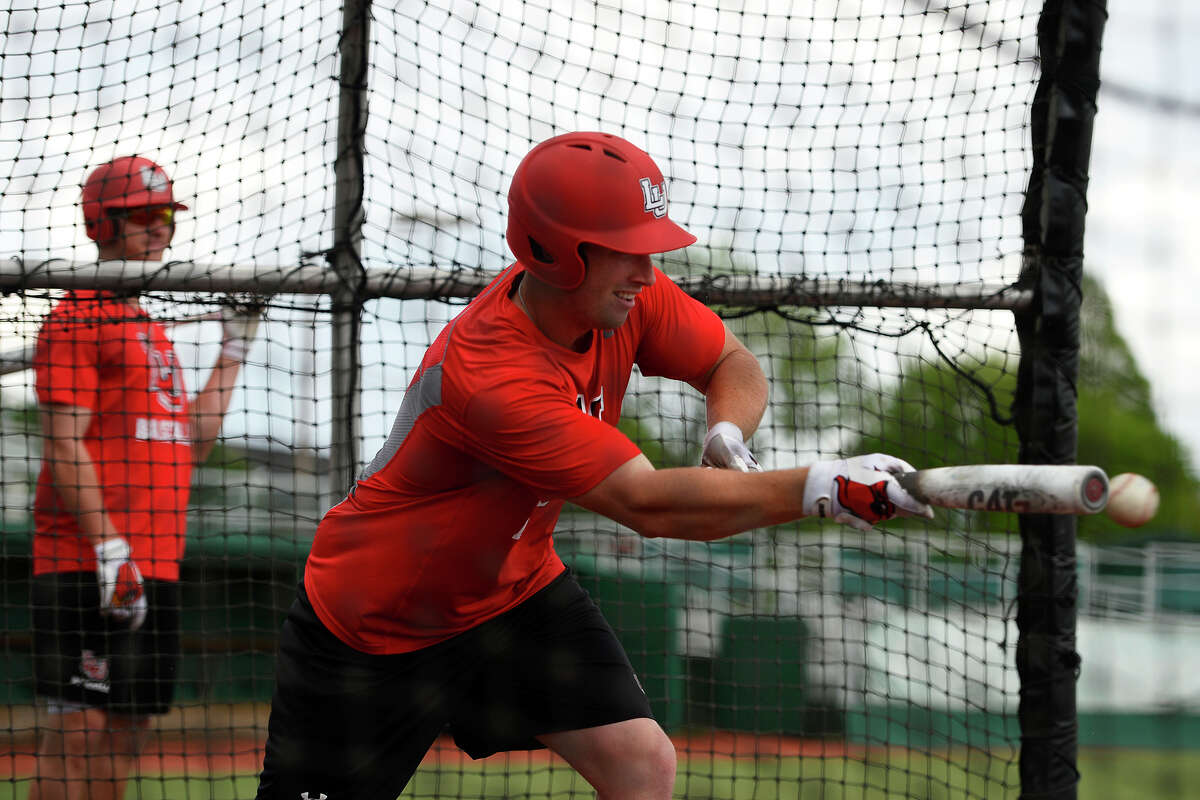 Lamar baseball's Reid Russell bunts during practice at Vincent-Beck Stadium on Wednesday afternoon. Coach Will Davis moved Russell to second in the batting order after getting advice from analytics site Baseball Prospectus. Photo taken Wednesday 4/12/17 Ryan Pelham/The Enterprise