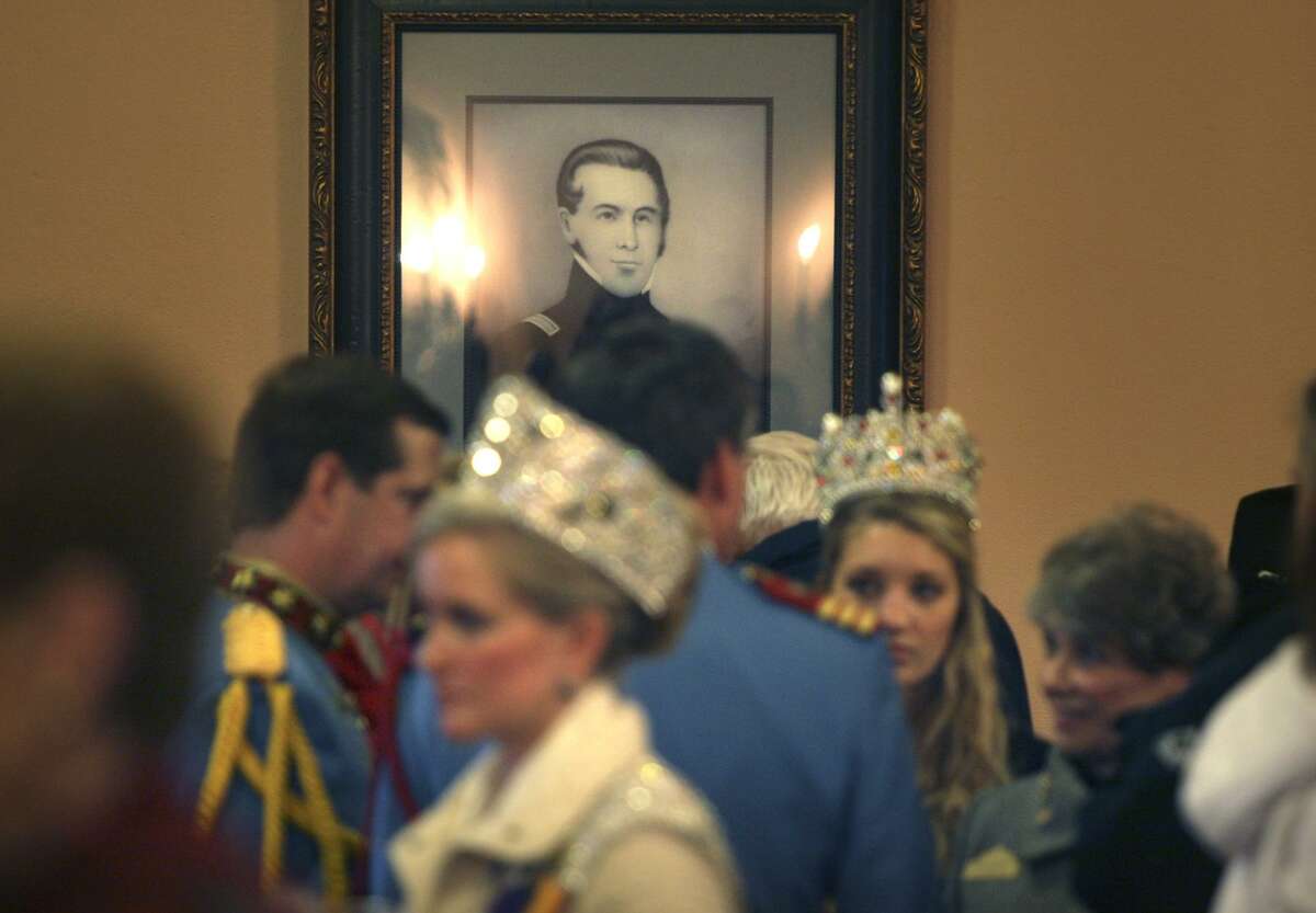 A portrait of William Barret Travis by an unknown artist appears to gaze over Fiesta royalty at a reception following The Daughters of the Republic of Texas announcement of their "Allies of the Alamo" campaign to help pay for preservation, maintenance and operations of the hallowed Texas shrine in 2010.