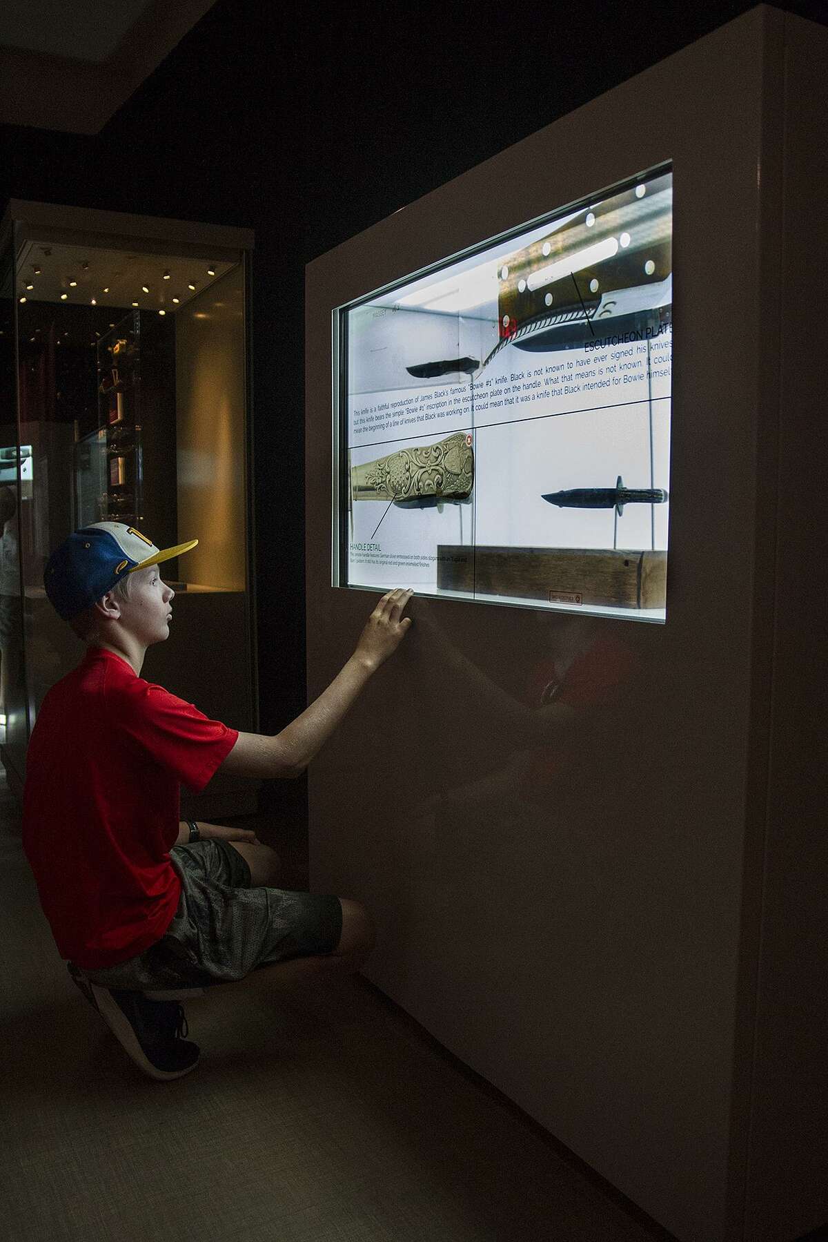 Aiden Eagon, 11, at an interactive touchscreen in the Jim Bowie exhibit at the Alamo April, 7. The screen uses translucent touchscreen technology allowing patrons to click the screen for detailed information about the artifacts featured.