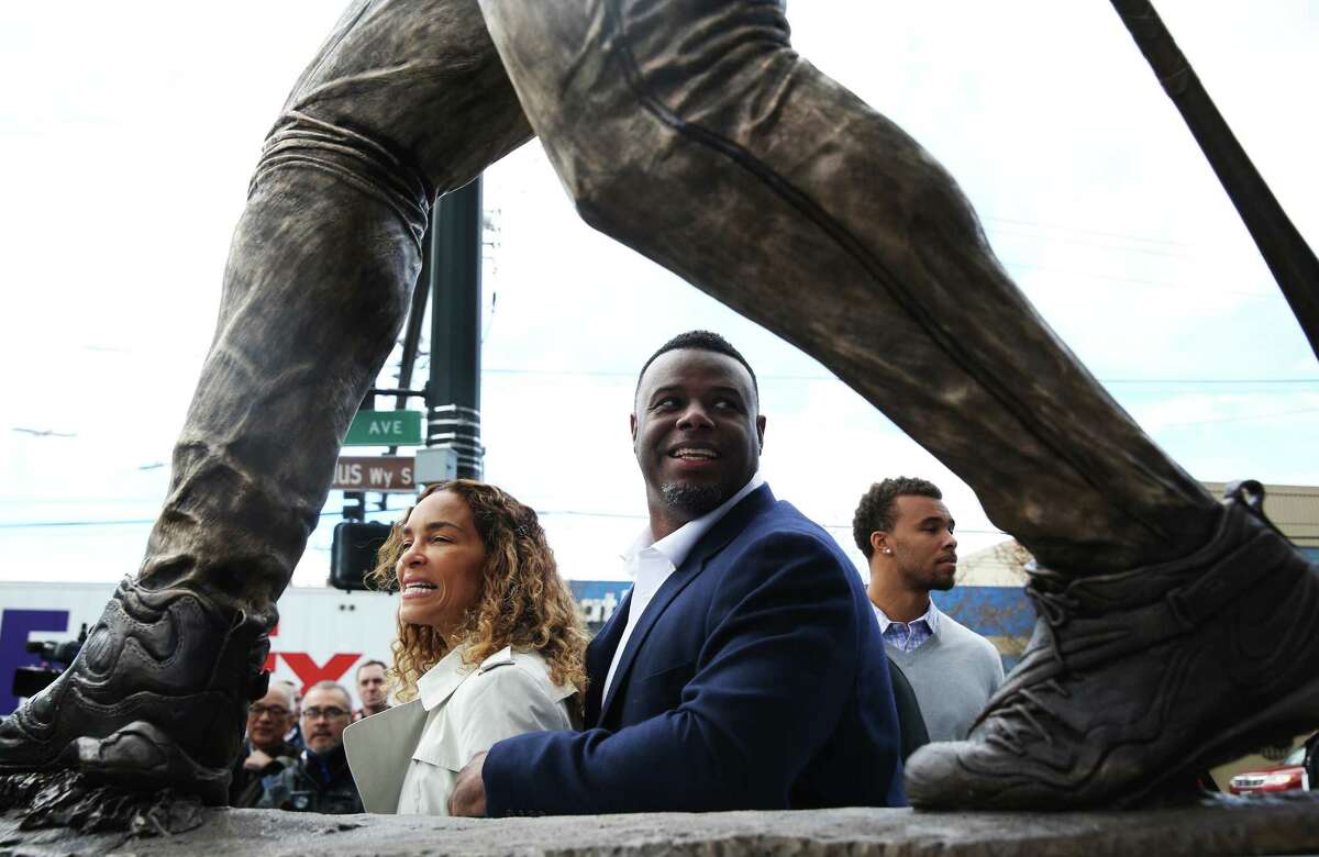 Former Mariner Ken Griffey Jr. stands with his wife Melissa and son Trey during the unveiling of a new statue in Griffey's likeness outside Safeco Field, April 13, 2017.