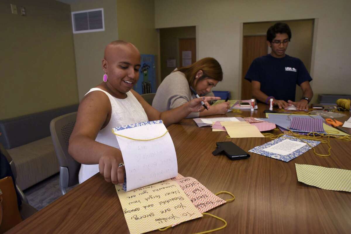 UTSA sophomore Sanah Jivani, left, and friends Itzel Esquivel and Bharath Ram create crafts with positive messages at UTSA on April 6, 2017. Jivani lost all of her hair and was diagnosed with a severe form of alopecia. She founded the Love Your Natural Self Foundation, a 501(c)3 nonprofit, which has a curriculum that has been implemented in more than 40 high school campuses in Texas.