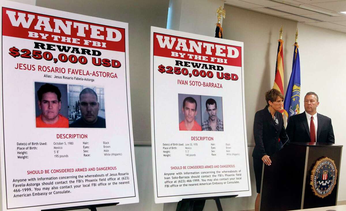 FILE - In this July 9, 2012, file photo, with wanted posters off to the side, Laura E. Duffy, United States Attorney Southern District of California, and FBI Special Agent in Charge, James L. Turgal, Jr., right, announce the indictments on five suspects involved in the death of U.S. Border Patrol agent Brian Terry in Tucson, Ariz. Mexican authorities have arrested the suspected shooter in the 2010 killing of Terry, whose death exposed a bungled gun-tracking operation by the federal government. In a joint statement issued by Mexico's navy and its federal Attorney General's Office on Thursday, April 13, in Mexico City that the suspect who's name wasn't released in Terry's death was arrested near the border between the states of Sinoloa and Chihuahua, a mountainous region note drug activity. (AP Photo/Ross D. Franklin, File)