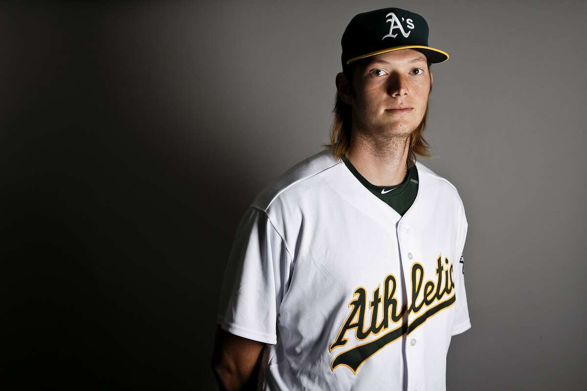 This is a 2017 photo of pitcher A.J. Puk of the Oakland Athletics baseball team poses for a portrait. This image reflects the Athletics active roster as of Wednesday, Feb. 22, 2017, when this image was taken. (AP Photo/Chris Carlson)