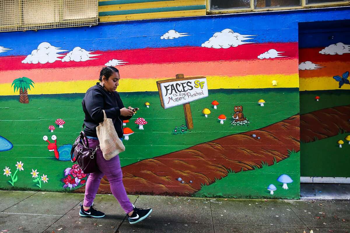 Kailey Norris walks from her car to her office in the Haight district of San Francisco, California, on Thursday, April 13, 2017.