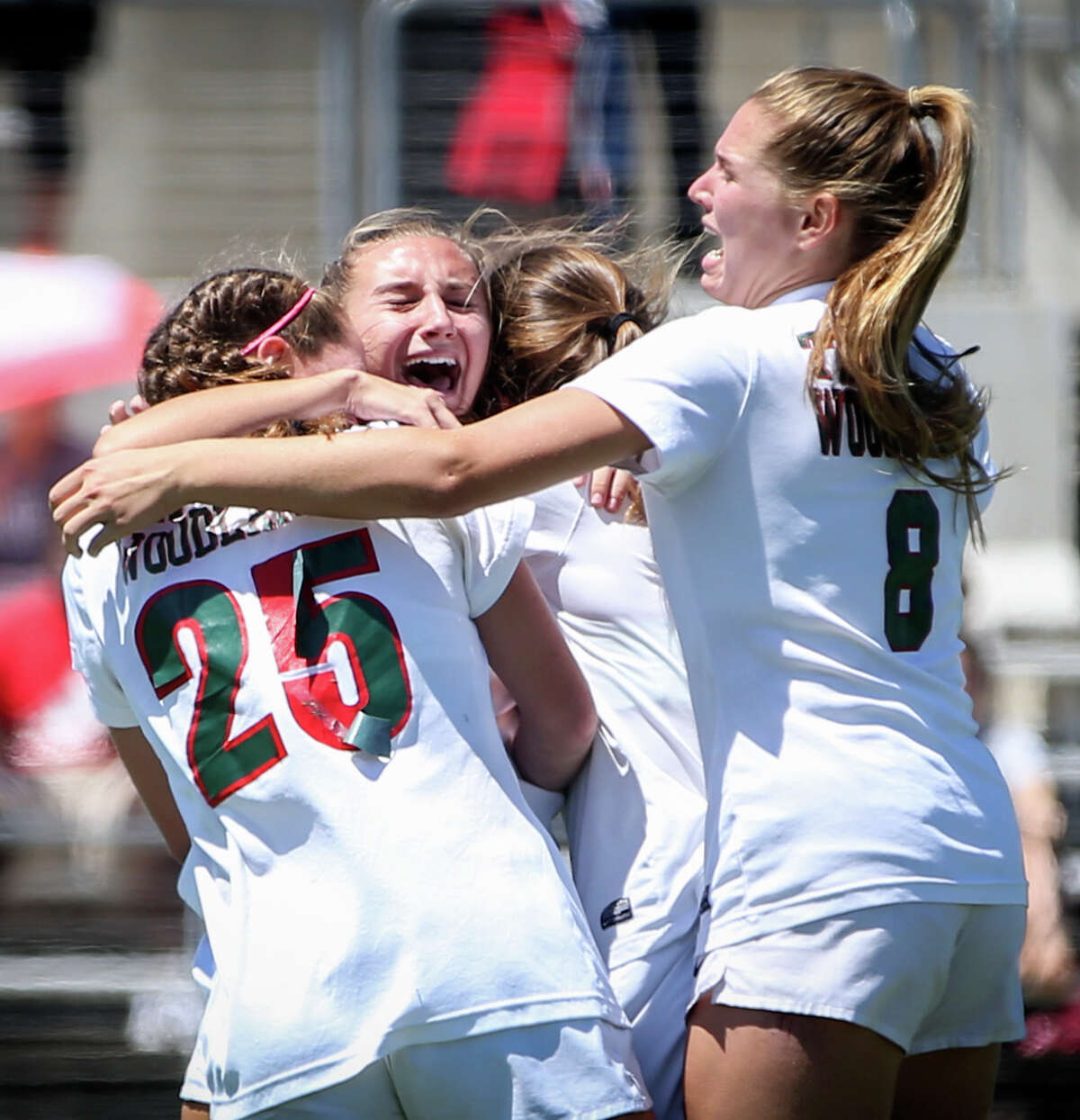 The Woodlands Lady Highlanders celebrate during the varsity girls soccer game against Klein on Friday, April 7, 2017, at Kelly Reeves Stadium in Austin.