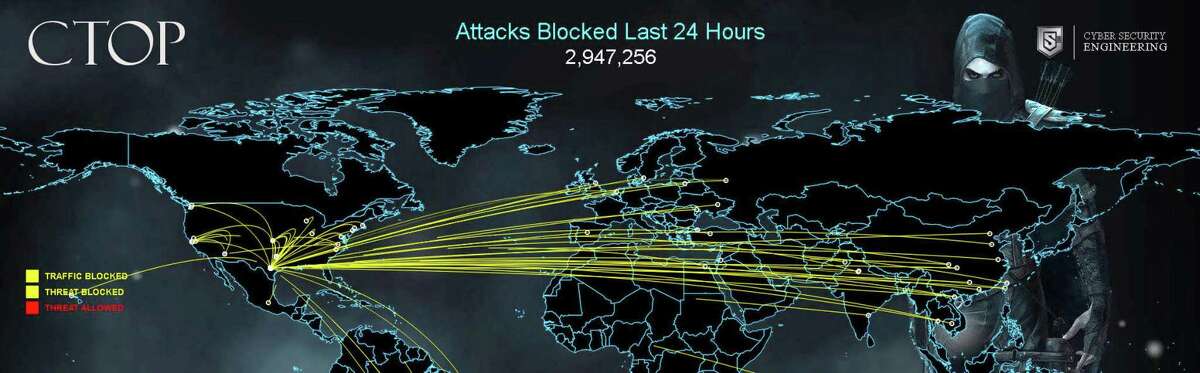A map of real-time, continually updated data shows cyberattacks trying to get inside the USAA firewall last month in this screen capture provided by USAA. The text at the top center of the image indicates how many attacks had been blocked in the preceding 24 hours.