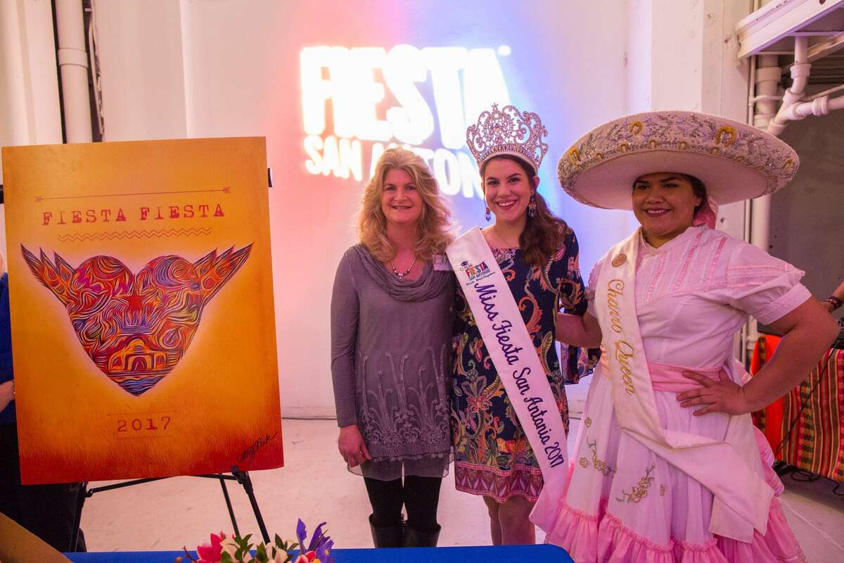 Artist Cathy Peck poses with Miss Fiesta San Antonio Madi Moad-Hageman and Charro Queen Yazmin Bernal at the unveiling of the Fiesta Fiesta poster.