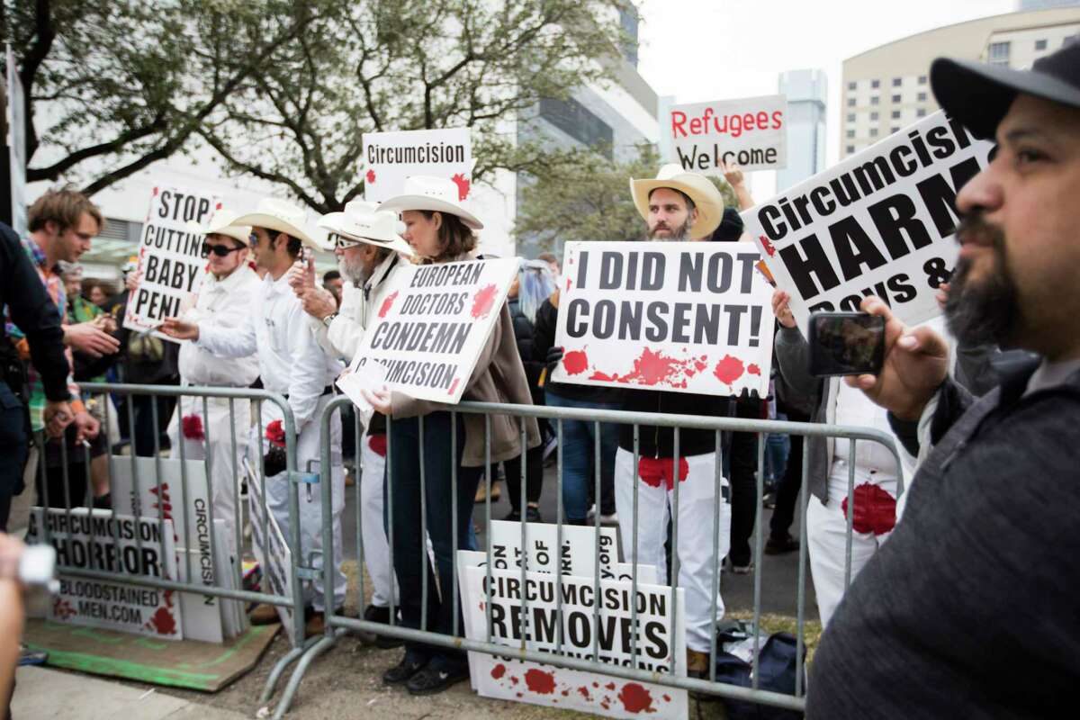 Demonstrators protest against circumcision near the George R. Brown Convention Center where the Super Bowl LIVE events are taking place, Saturday, Feb. 4, 2017, in Houston. The demonstrators are part of Bloodstained Men and Friends an organization against circumcision. ( Marie D. De Jesus / Houston Chronicle )