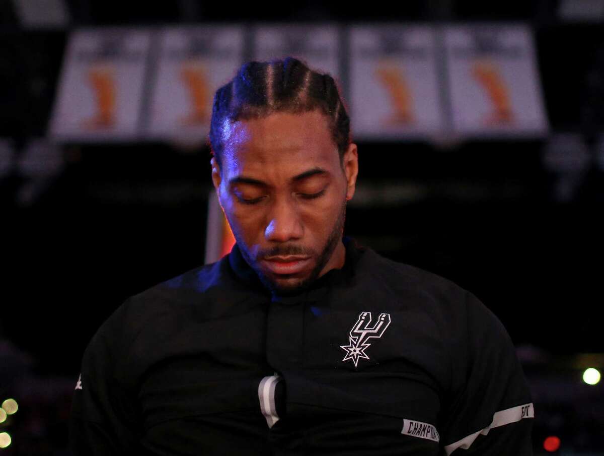 Spurs’ Kawhi Leonard stands during the national anthem before the game with the Utah Jazz on April 2, 2017 at the AT&T Center.