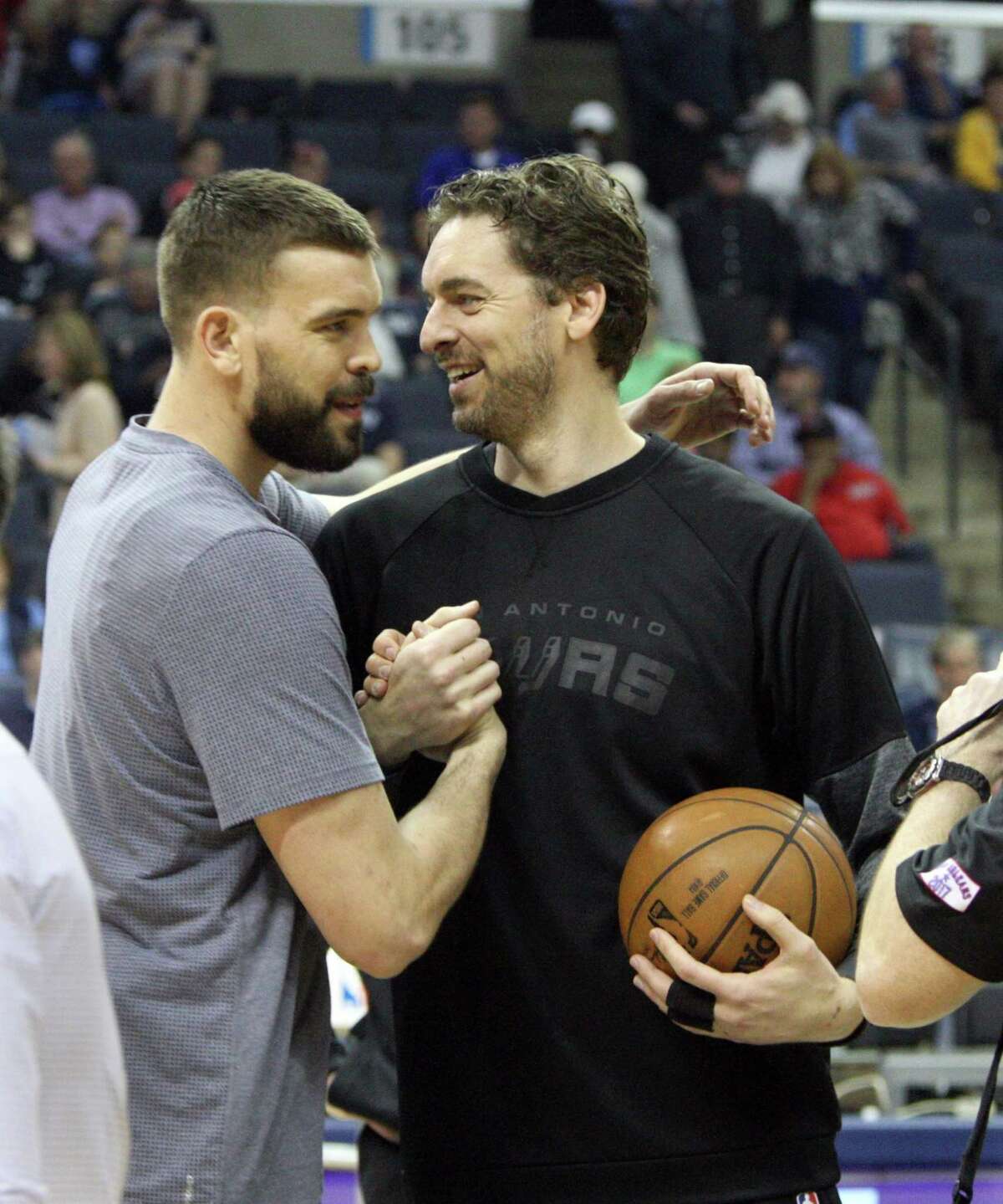 Spurs’ Pau Gasol is embraced by his brother, Grizzlies’ Marc Gasol, prior to the gameon March 18, 2017, in Memphis, Tenn.