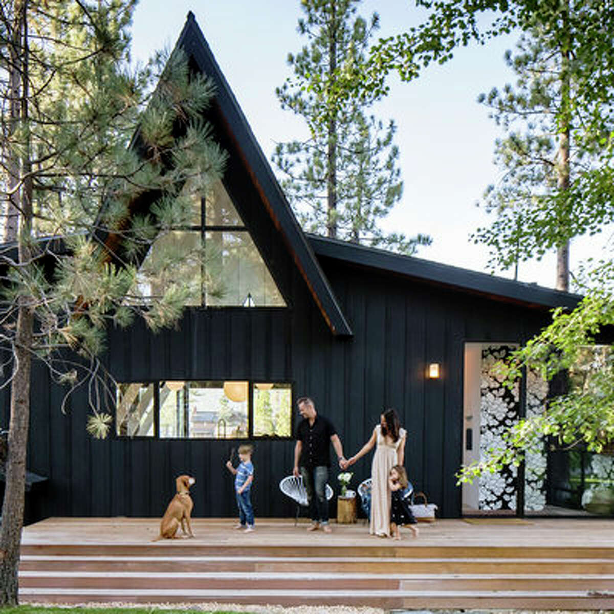 Back in black Exterior paint in Flat Black; dunnedwards.com From the moment Jason sketched the A-Frame out on a napkin, the couple knew they wanted it paint the cedar exterior black. “It blends in with the bark on the pine trees that are on the property and keeps the house very hidden from the street,” says Laura.