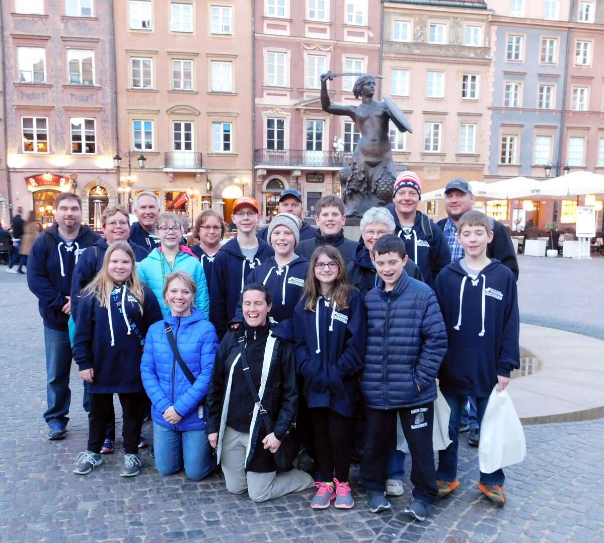The Bad Axe Destination Imagination team members and their chaperones pose in front of the Symbol of Warsaw statue during their recent visit to Poland last month. (Submitted photo)       