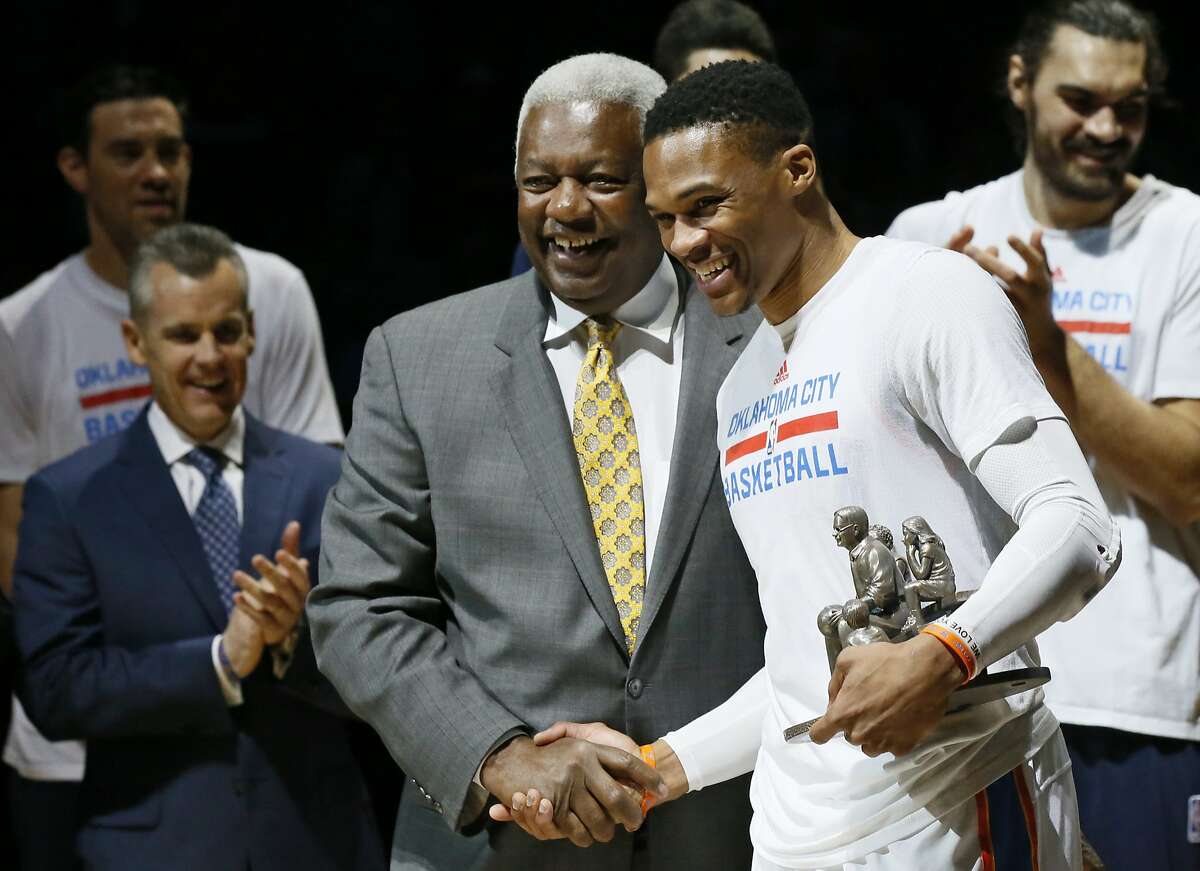 Oklahoma City Thunder guard Russell Westbrook, right, is congratulated by Oscar Robertson, left, on his triple-double record before an NBA basketball game between the Denver Nuggets and the Oklahoma City Thunder in Oklahoma City, Wednesday, April 12, 2017. (AP Photo/Sue Ogrocki)