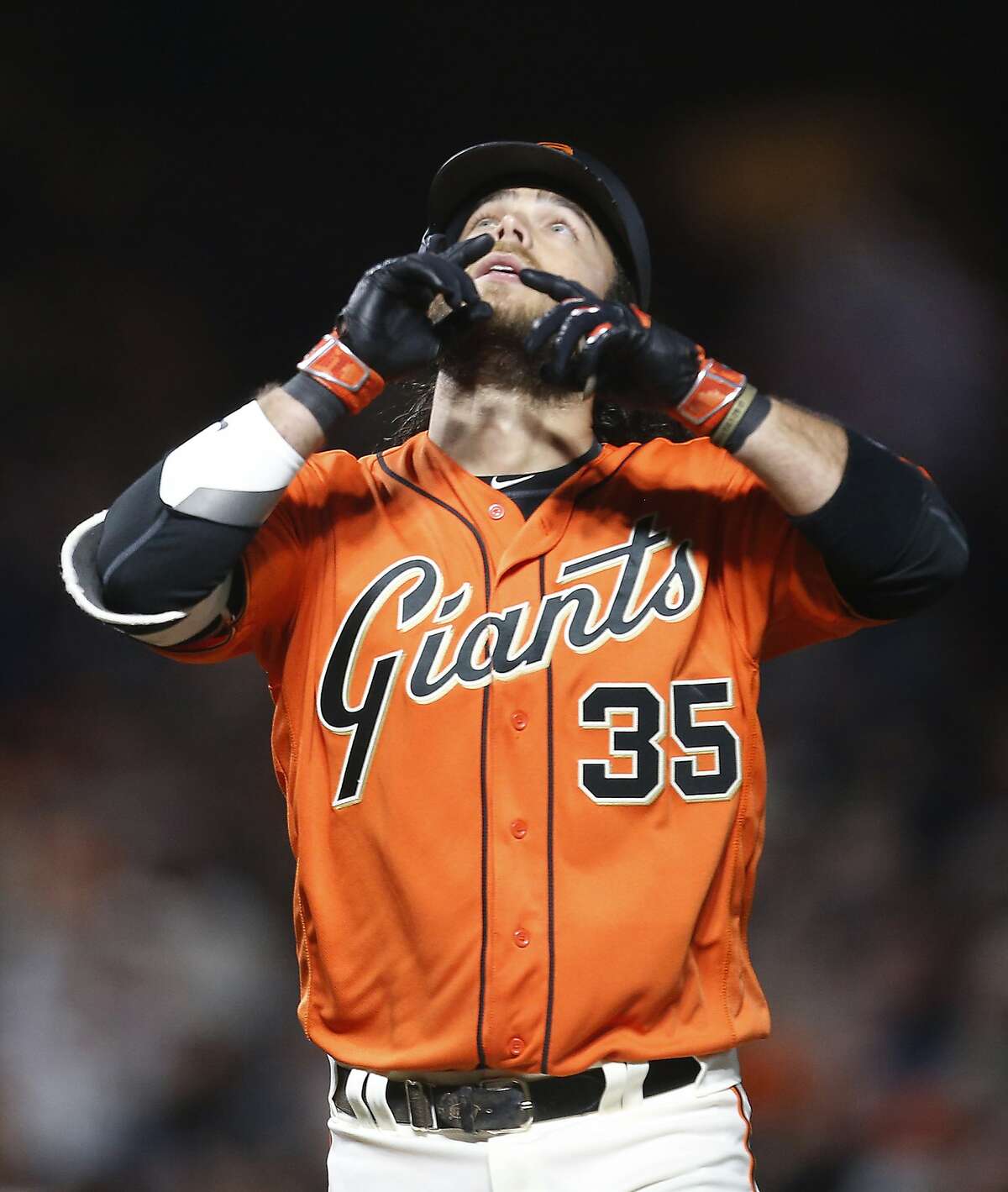 San Francisco Giants' Brandon Crawford gestures as he crosses home plate after hitting a home run against the Colorado Rockies during the fourth inning of a baseball game, Friday, April 14, 2017, in San Francisco. (AP Photo/Tony Avelar)