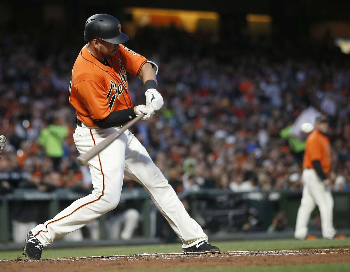 San Francisco Giants Chris Marrero swings on a two-run home run against the Colorado Rockies during the second inning of a baseball game, Friday, April 14, 2017, in San Francisco. (AP Photo/Tony Avelar)