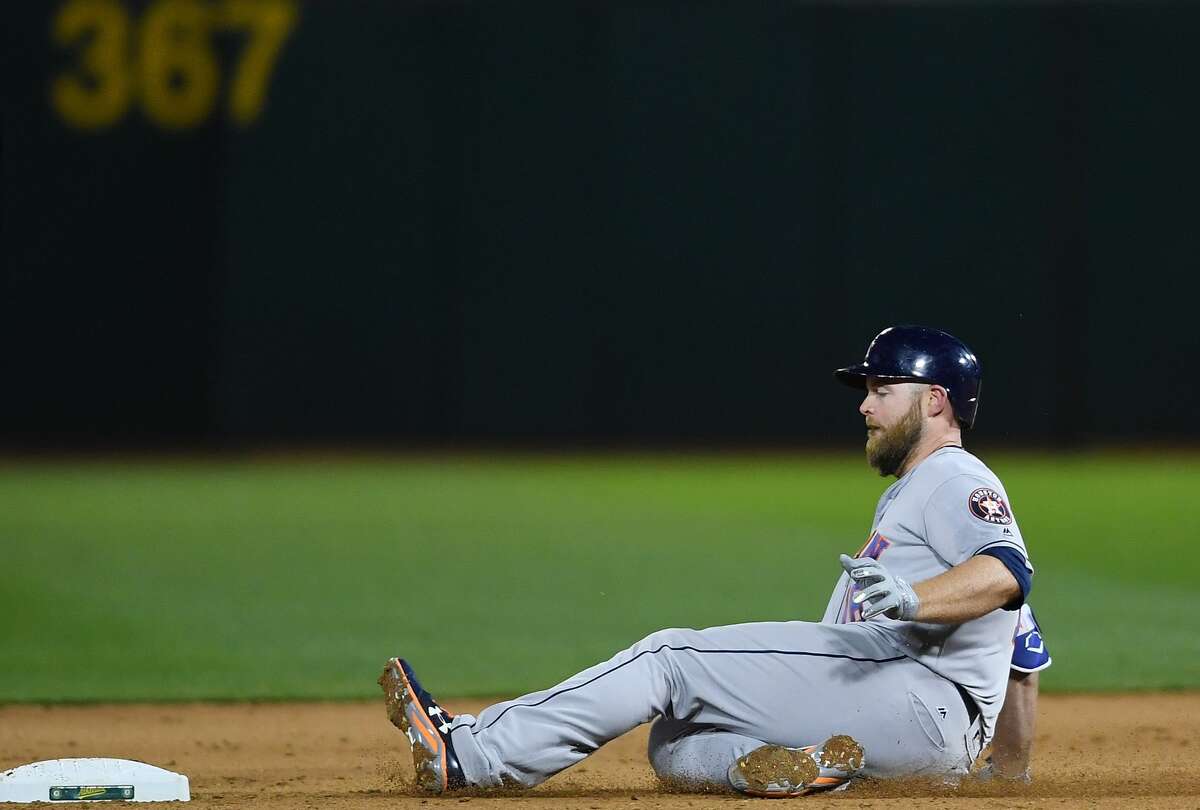 OAKLAND, CA - APRIL 14: Brian McCann #16 of the Houston Astros slides into second base with a two-run rbi double against the Oakland Athletics in the top of the seventh inning at Oakland Alameda Coliseum on April 14, 2017 in Oakland, California. (Photo by Thearon W. Henderson/Getty Images)