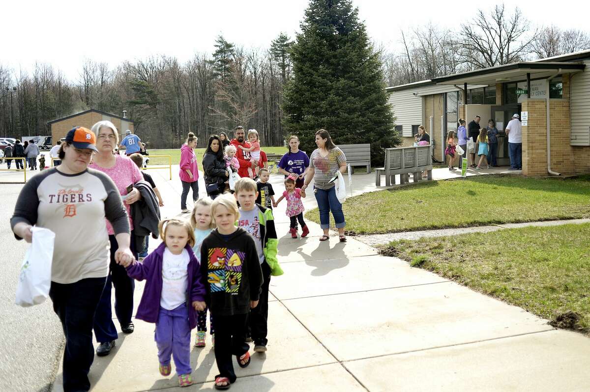 Participants leave the Greater Midland Coleman Family Center to start the egg hunt on Saturday in Coleman. Participants gathered clues that led them to stops at businesses, churches and the fire department around town where they collected eggs. After the hunt participants were welcomed back to the Coleman Family Center for food, games and prizes.