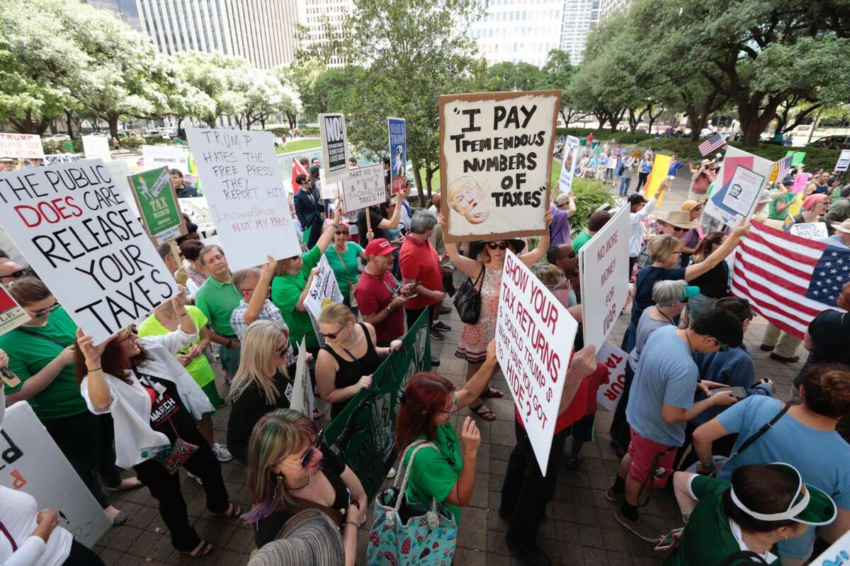 Demonstrators begin a march demanding greater governmental transparency and the release of President Donald Trump's tax returns during a protest on Saturday, April 15, 2017, in Houston. (Brett Coomer / Houston Chronicle)