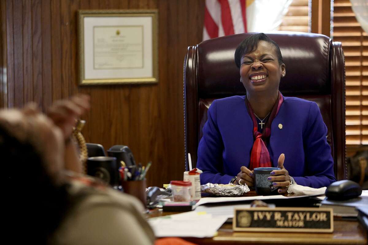 Mayor Ivy Taylor laughs as she takes a break for a breakfast taco with Leslie Garza, Director of Communications for the Mayor's office, in her office at City Hall on February 22, 2017.