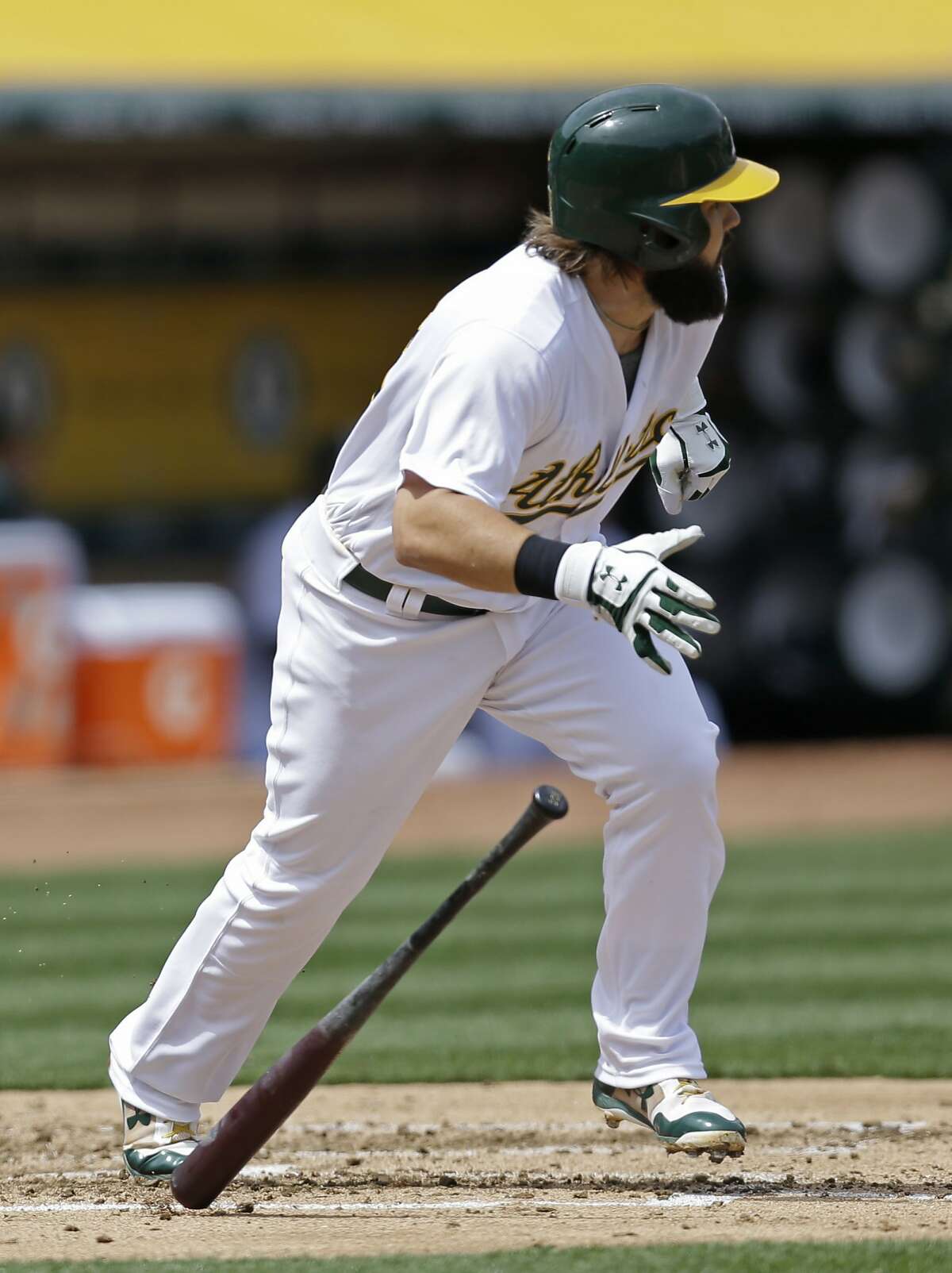 Oakland Athletics' Jaff Decker drops his bat after hitting an RBI single off Houston Astros pitcher Lance McCullers Jr. in the second inning of a baseball game Saturday, April 15, 2017, in Oakland, Calif. (AP Photo/Ben Margot)