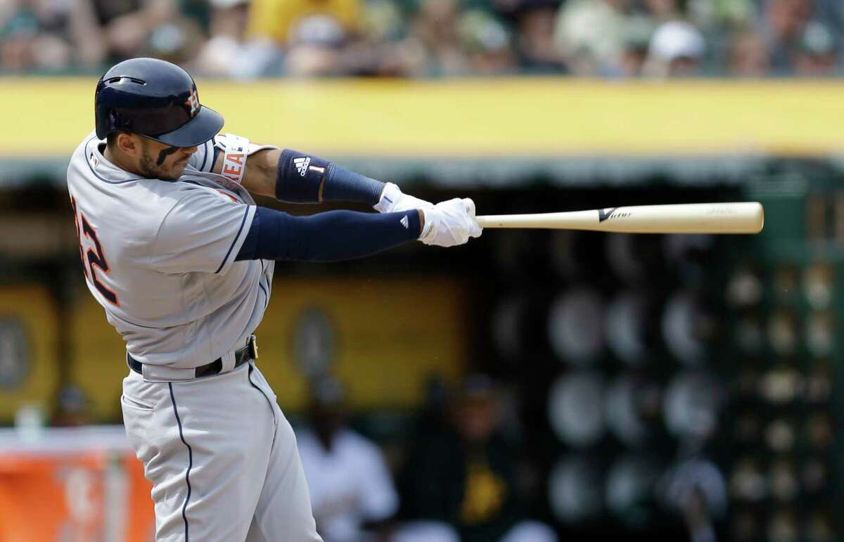 Houston Astros Carlos Correa swings against the Oakland Athletics in the sixth inning of a baseball game Saturday, April 15, 2017, in Oakland, Calif. (AP Photo/Ben Margot)