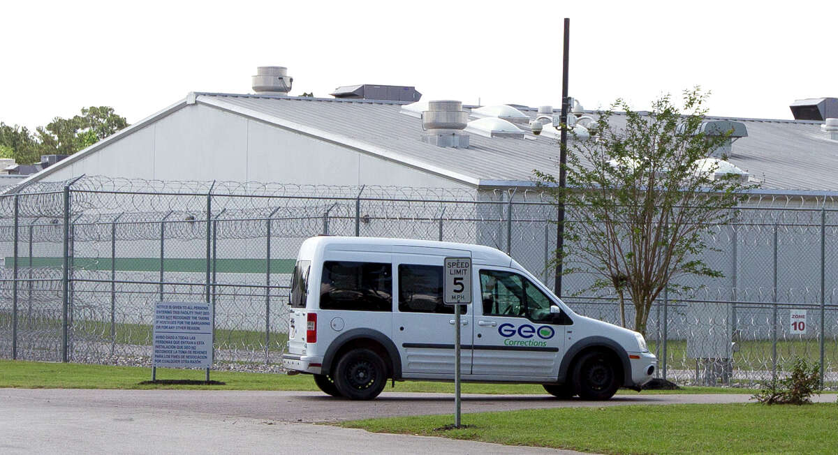 A van with the GEO Group, a private prison company, drives on the Joe Corley Detention Center property on Hilbig Road, Friday, April 14, 2017, in Conroe.