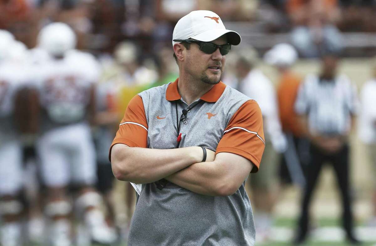Coach Tom Herman watches his players warm up before the Longhorns’ Orange-White spring game on April 15, 2017, in Austin.
