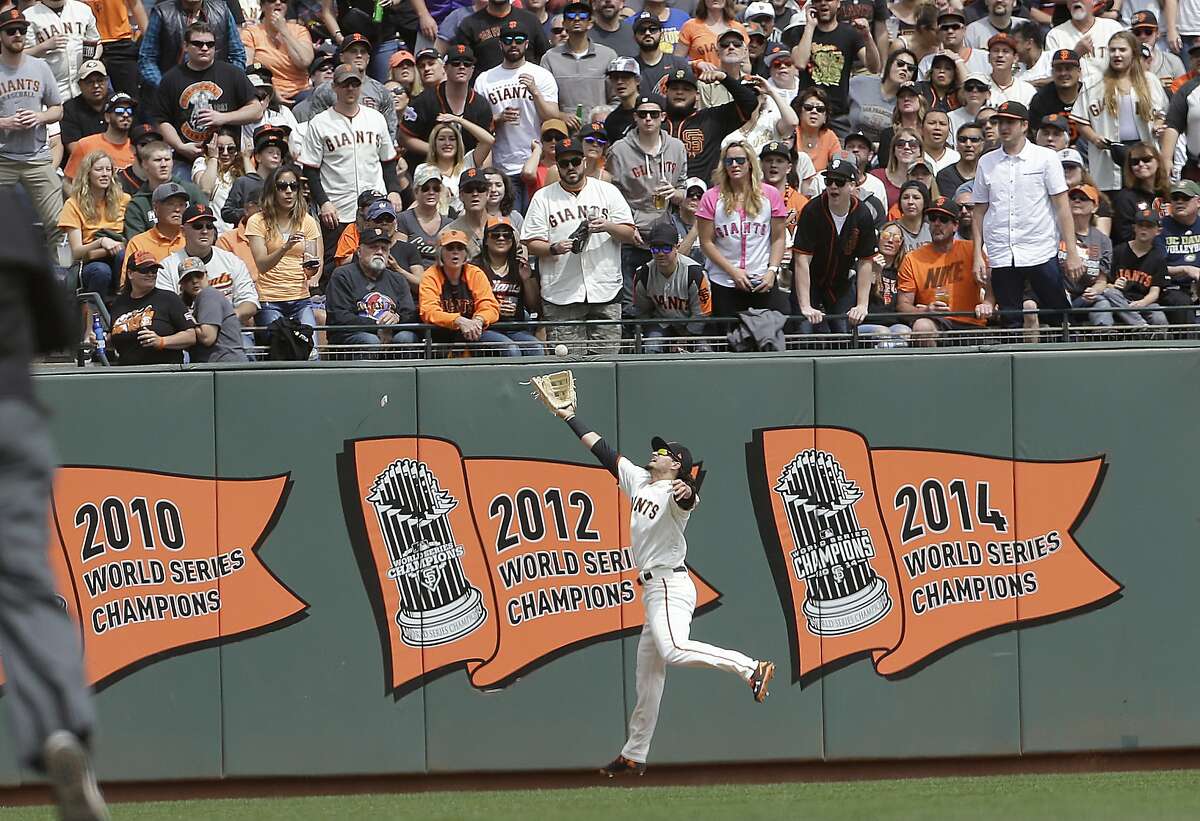 San Francisco Giants left fielder Todd Linden catches a fly ball