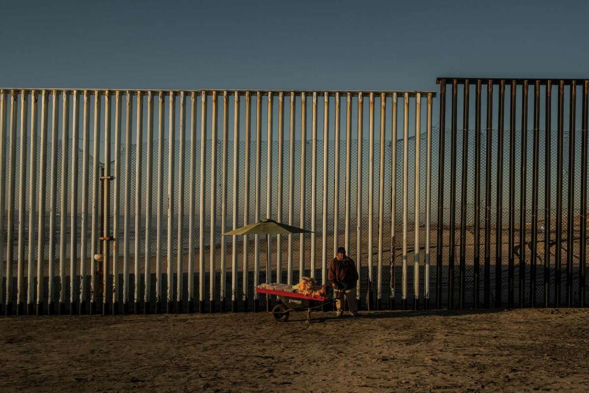 FILE-- A vendor set up along the U.S.-Mexico border fence on the beach in Tijuana, Mexico, Jan. 28, 2017. When the State Department released its annual human rights report in 2017, it contained many of the usual, harsh American judgments of other countries. What was notably missing, however, was the usual fanfare around the report and a news conference promoting it by the new secretary of state, Rex Tillerson, as Democratic and Republican administrations have almost always done. (Bryan Denton/The New York Times)