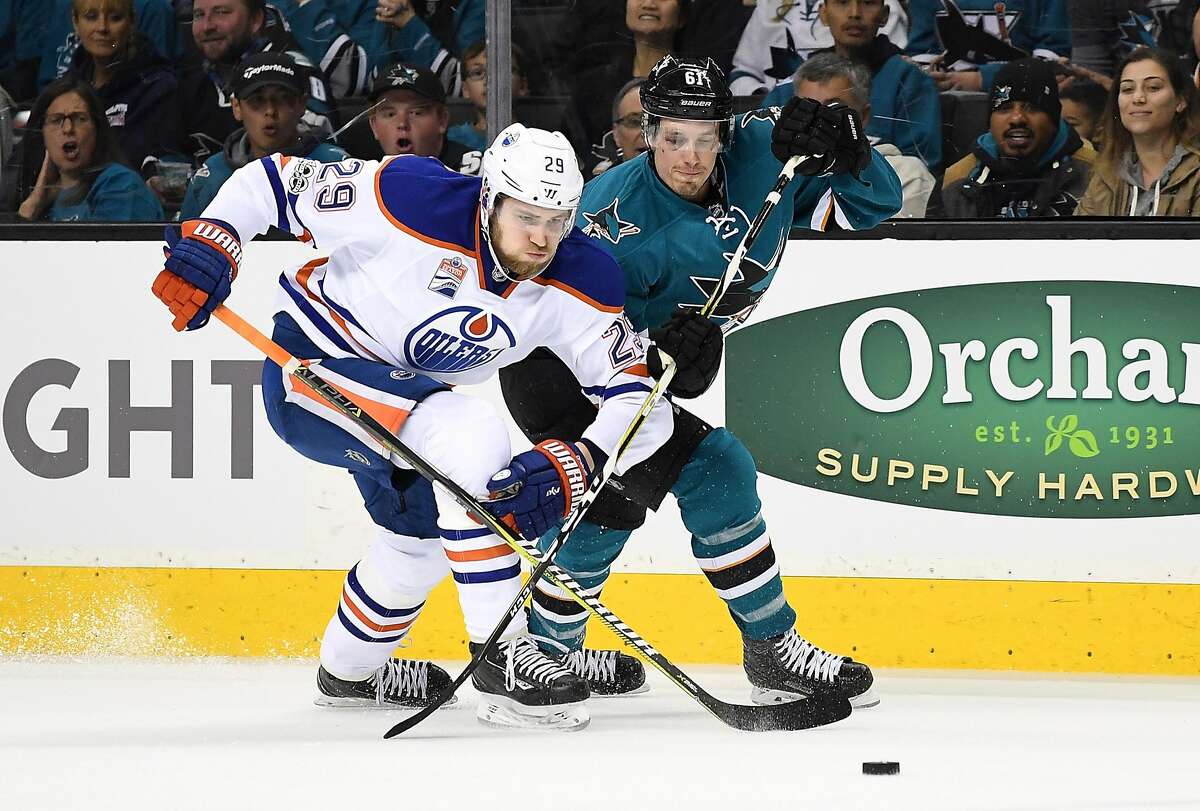 Leon Draisaitl of the Edmonton Oilers battles for control of the puck with Justin Braun of the San Jose Sharks during the first period in Game Three of the Western Conference First Round during the 2017 NHL Stanley Cup Playoffs at SAP Center on April 16, 2017 in San Jose, California.