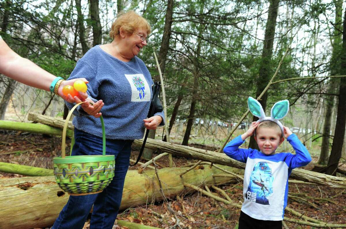 Rocco Masso, 5, of Fairfield, dons his bunny ears before resuming the hunt for Easter eggs during the Audubon Society Center at Fairfield's "Egg Hunt Egg-Stravaganza" event in Fairfield, Conn., on Saturday Apr. 15, 2017. As many as 500 people came out to take part in the hunt, which took visitors along the scenic trails behind the center. Volunteers from the National Charity League's Easton and Fairfield Chapters came to help stuff the Easter eggs with surprises and crafts were held inside along with a visit from the Easter Bunny himself.